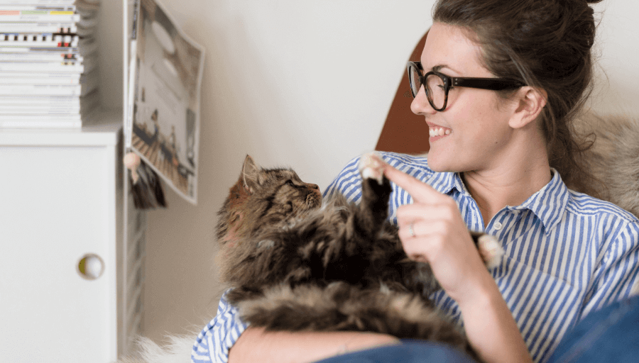 woman playing a cat