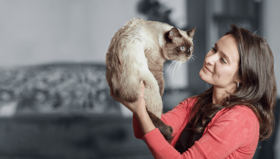 woman holding a cat