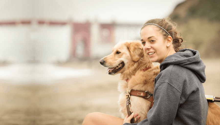 woman sitting with a dog
