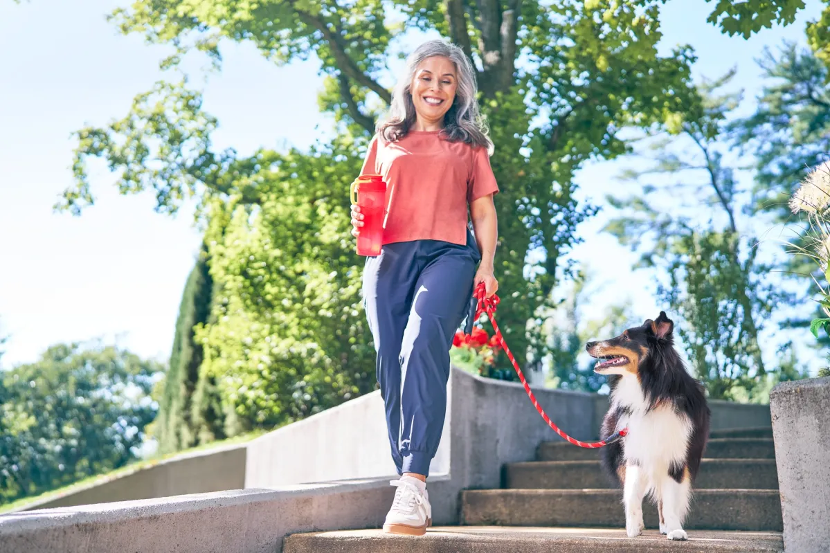 woman dog walk