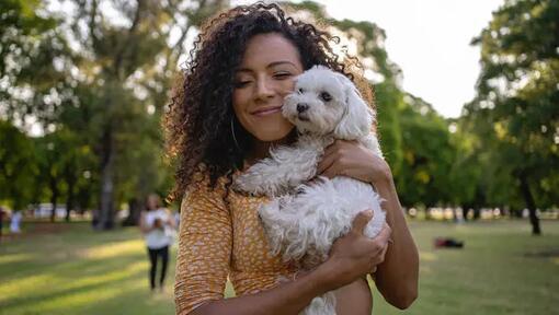 Woman and her dog in park