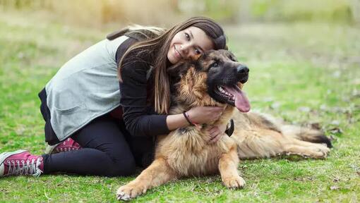 Woman hugging dog